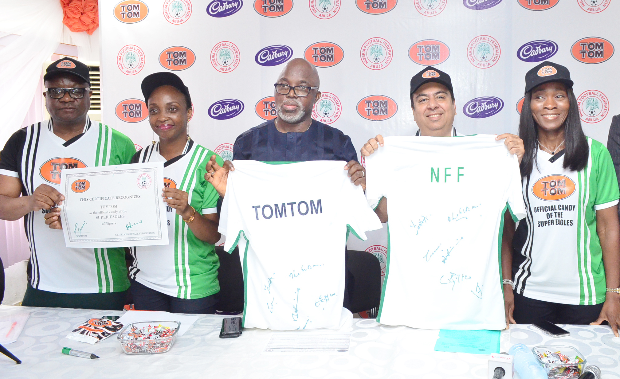 L-R: Director, Corporate and Government Affairs, West Africa, Cadbury, Mr. Bala Yesufu; Category Marketing Lead, West Africa, Cadbury, Mrs. Chidinma Uwadiae; President, Nigeria Football Federation (NFF), Mr. Amaju Pinnick; Managing Director, West Africa, Cadbury, Mr. Amir Shamsi and Finance Director, West Africa, Cadbury, Mrs. Yimika Adeboye, at the Cadbury/NFF partnership unveiling TOMTOM as the official candy of the Super Eagles in Lagos.